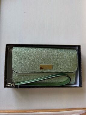 Kenzie boxed glitter medium flap phone wristlet in the color seawater